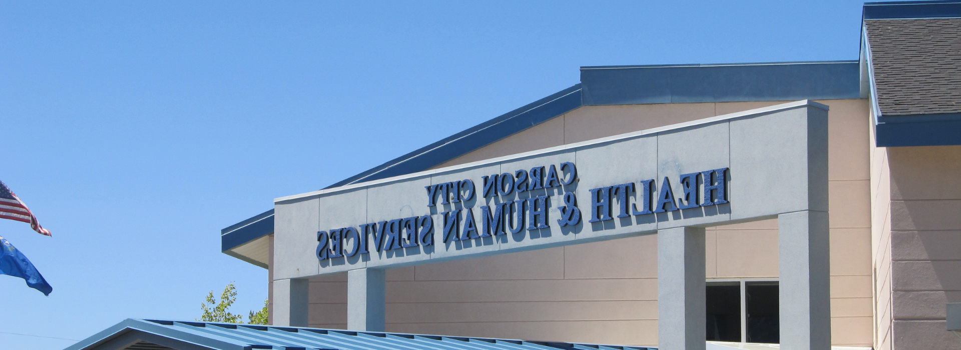 blue and white building with Carson City Health and Human Services on it